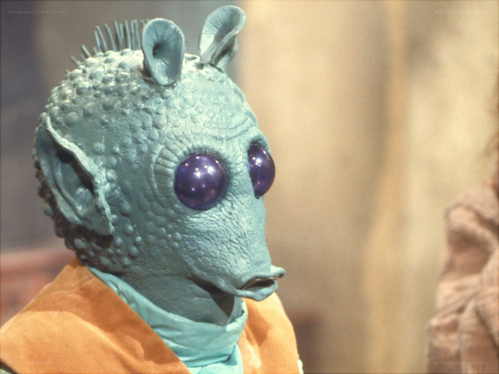 blue alien with purple eyes
