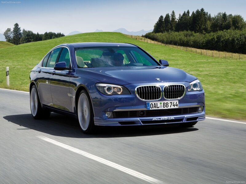 blue alpina-b7 driving on road