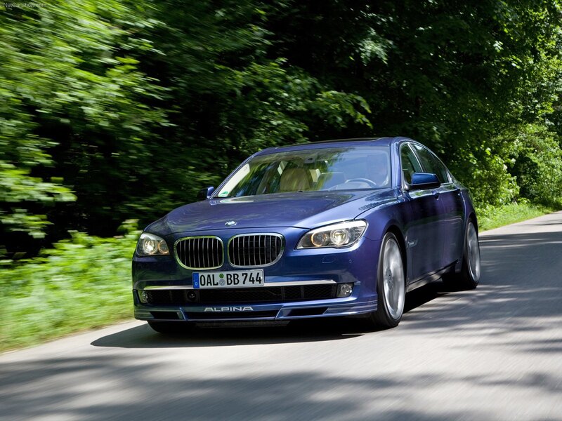 blue alpina-b7 driving on road