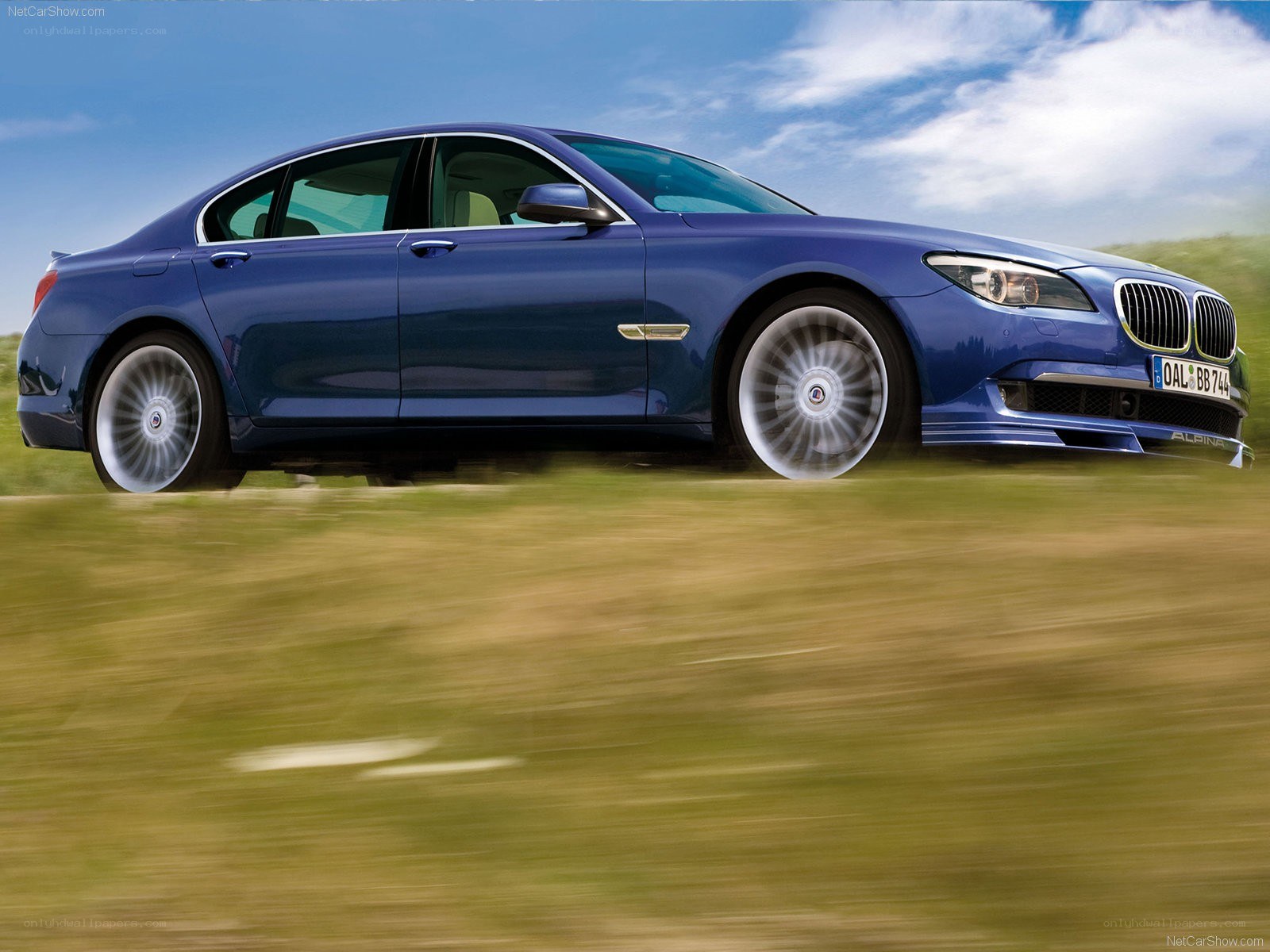blue alpina-b7 sedan in motion