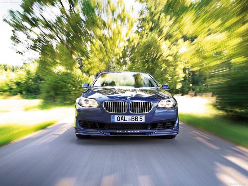 blue alpina car on a road