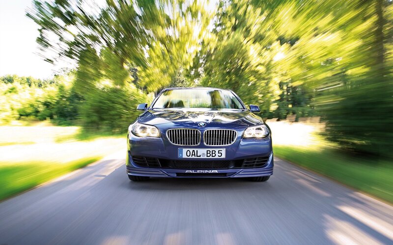 Blue Alpina car on a road