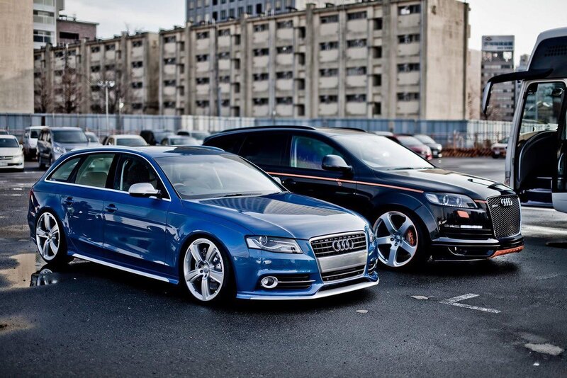 Blue and black Audi cars in parking lot