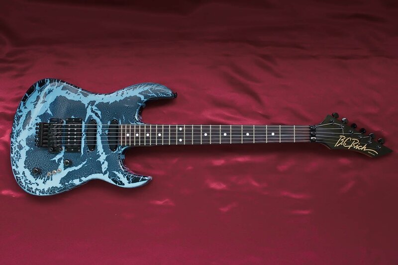 Blue and Black Electric Guitar — Red