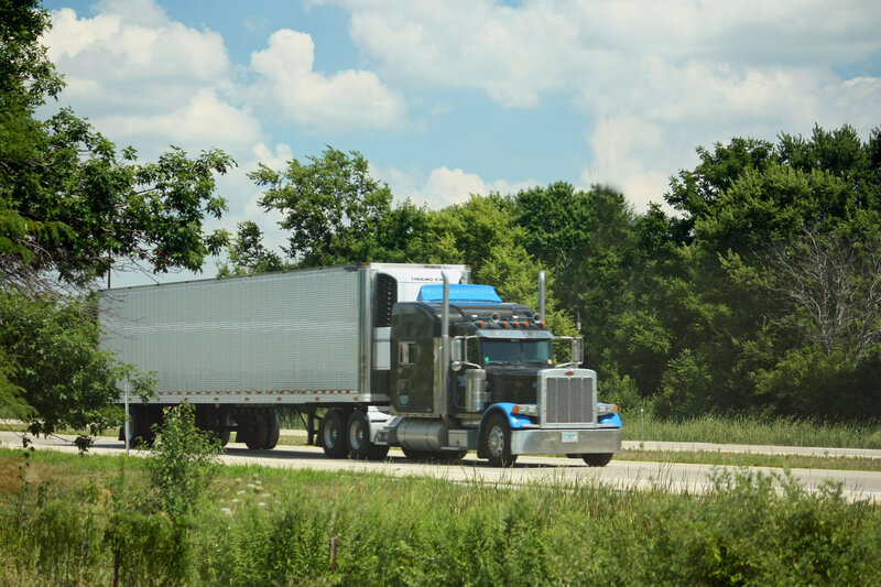 Blue and Black Semi-truck — Green