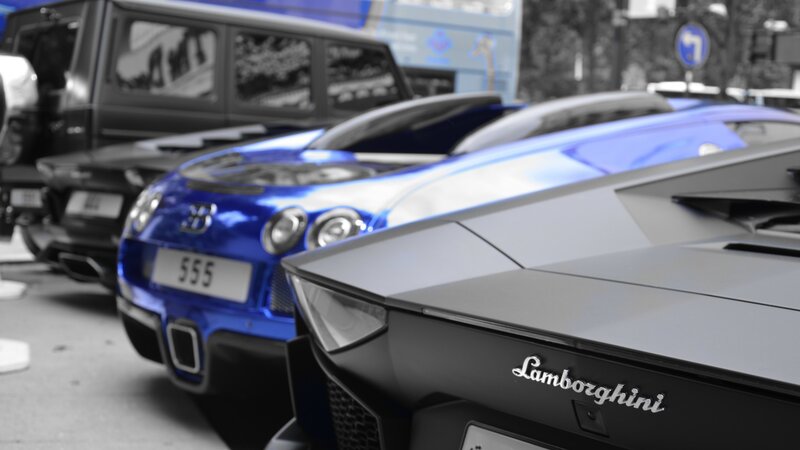 Blue and Black Sports Cars — Dramatic