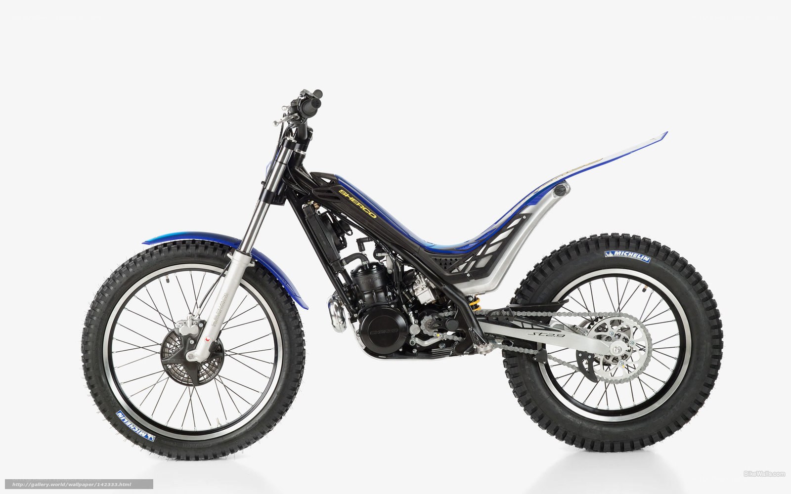 blue and black trial motorcycle