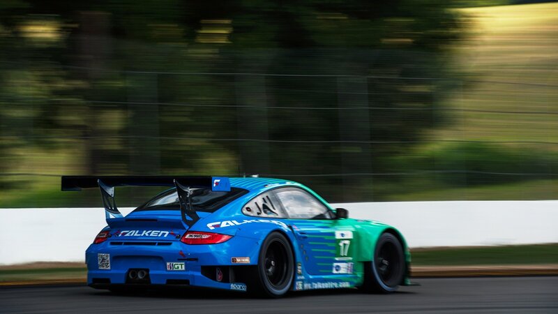 blue and green race car on track