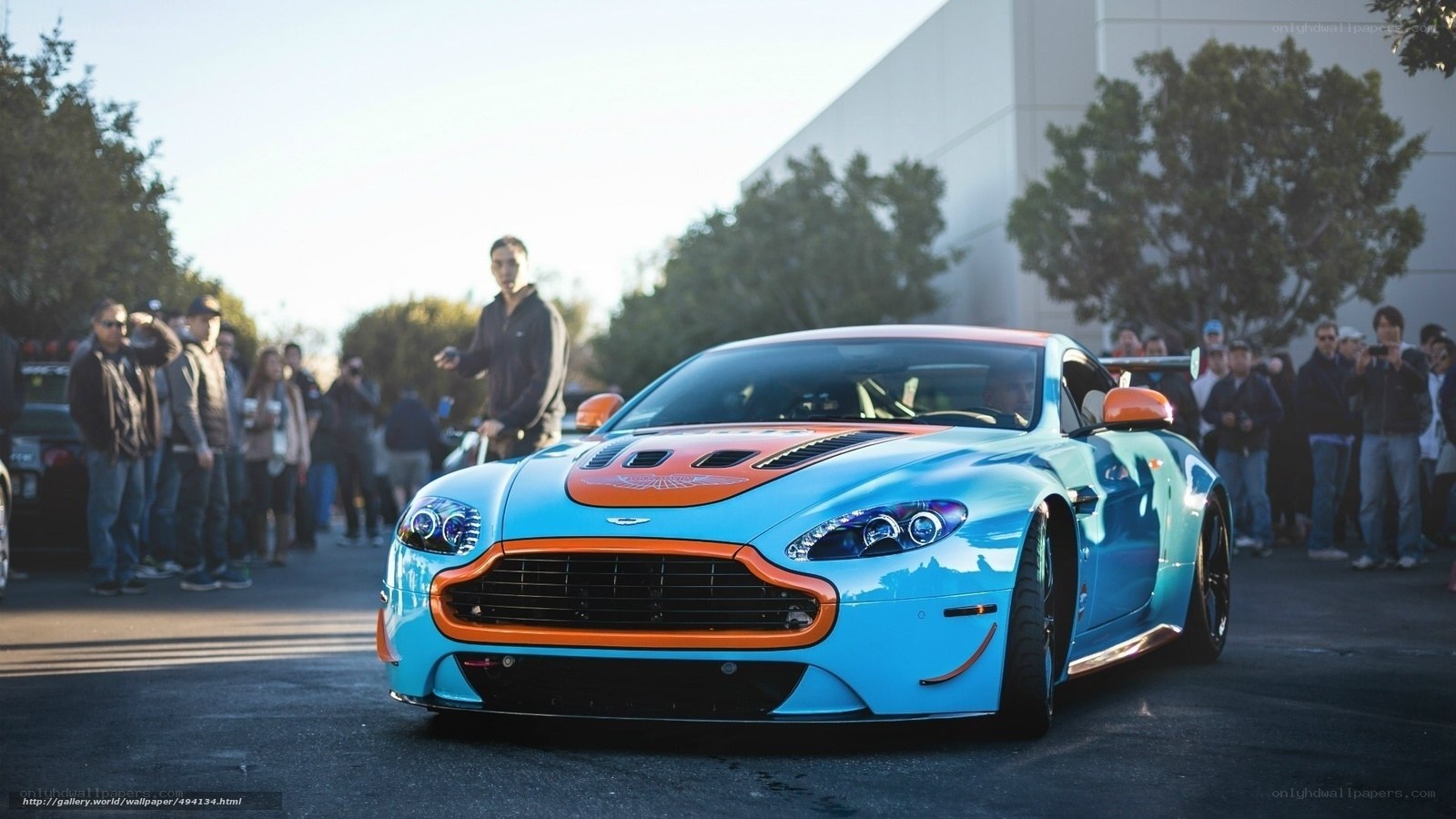 Blue and orange Aston Martin sports car