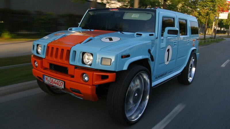 blue and orange hummer in motion