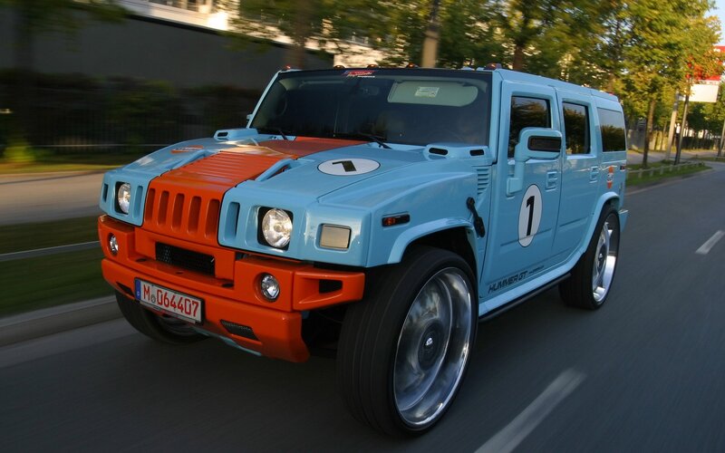 blue and orange Hummer in motion