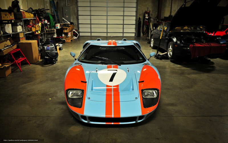 Blue and orange race car in garage