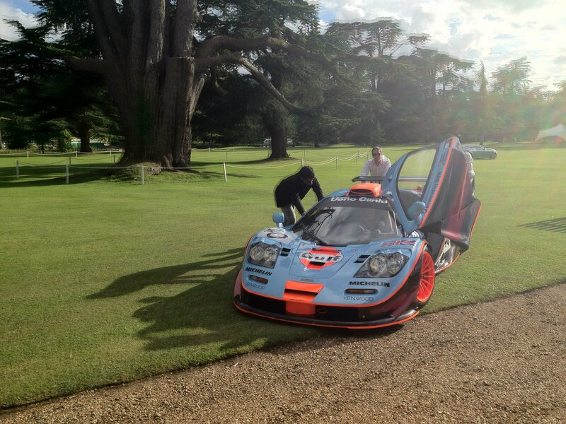 Blue and orange race car on lawn