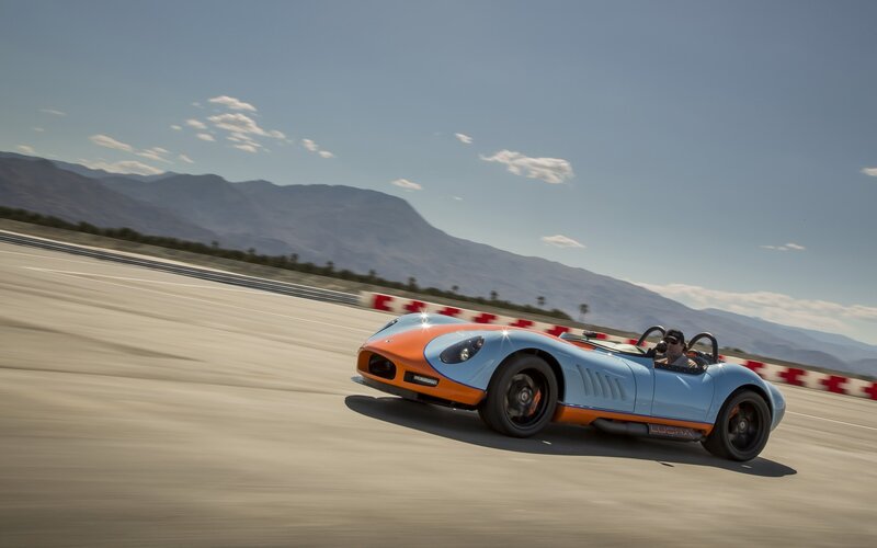 Blue and orange race car on track