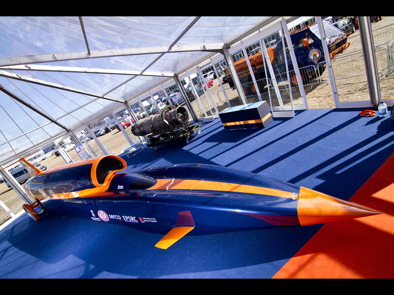 Blue and orange rocket car on display