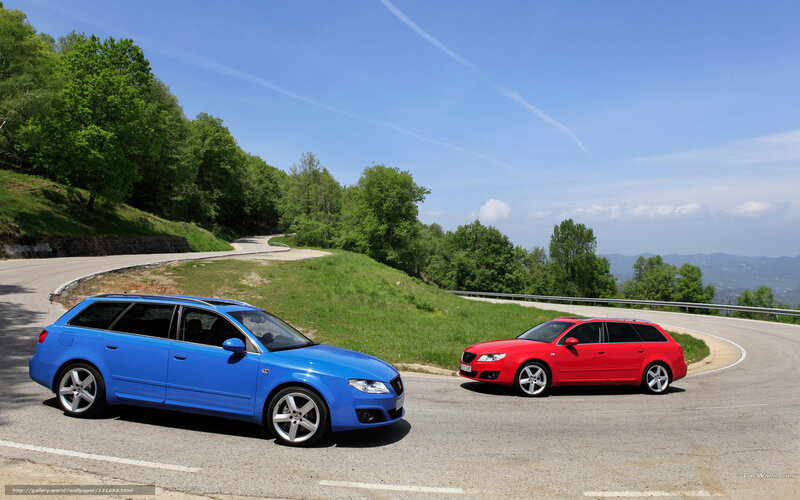 Blue and red cars on a winding road