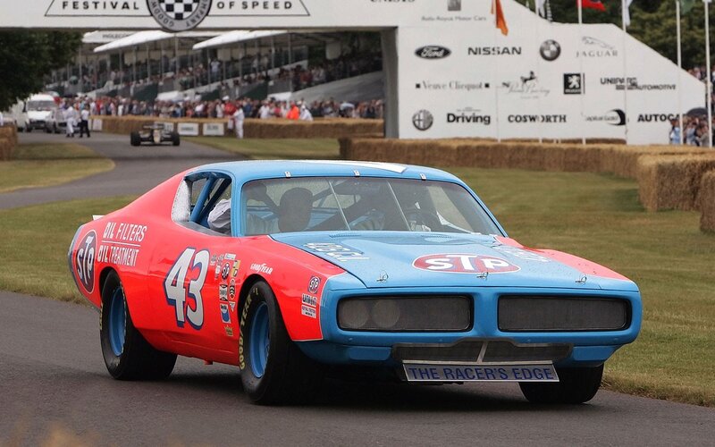 Blue and red race car on track