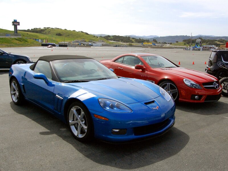 Blue and red sports cars on track
