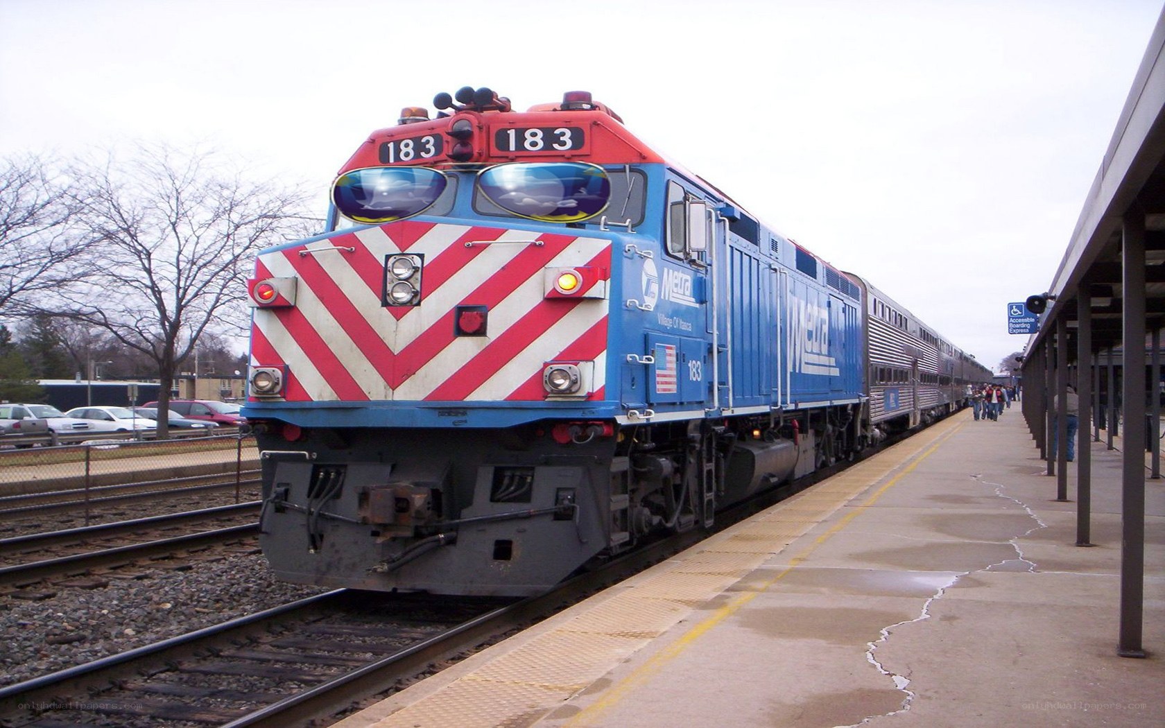 Blue and red train at station