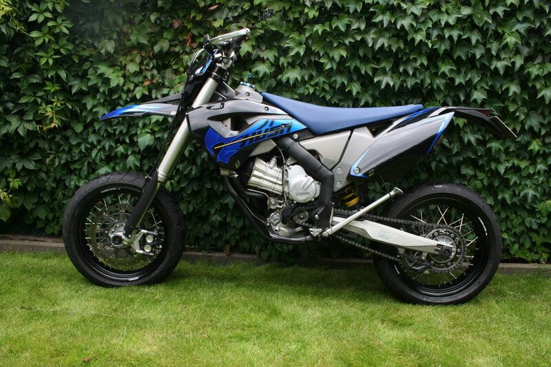 Blue and Silver Dirt Bike — Green