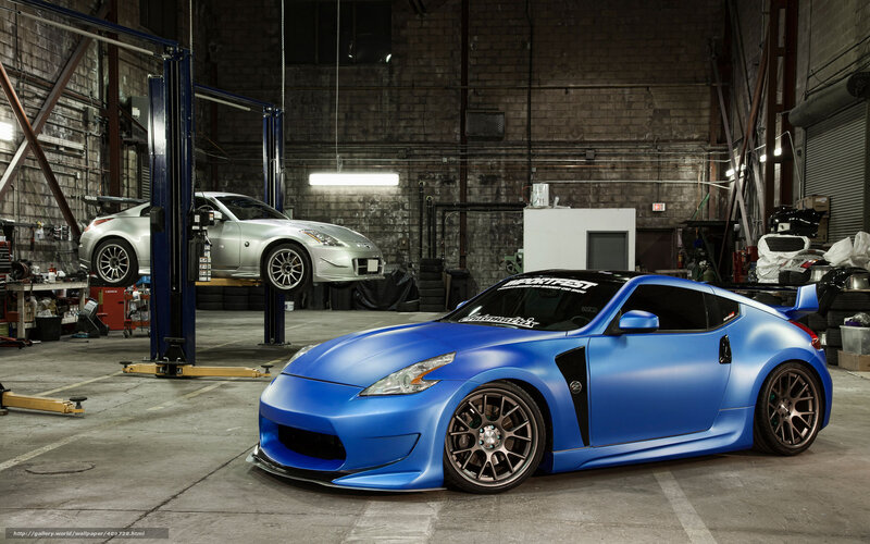 Blue and silver sports cars in garage