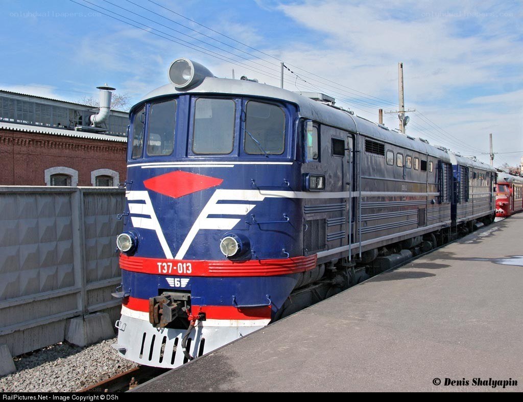 Blue and silver train on platform