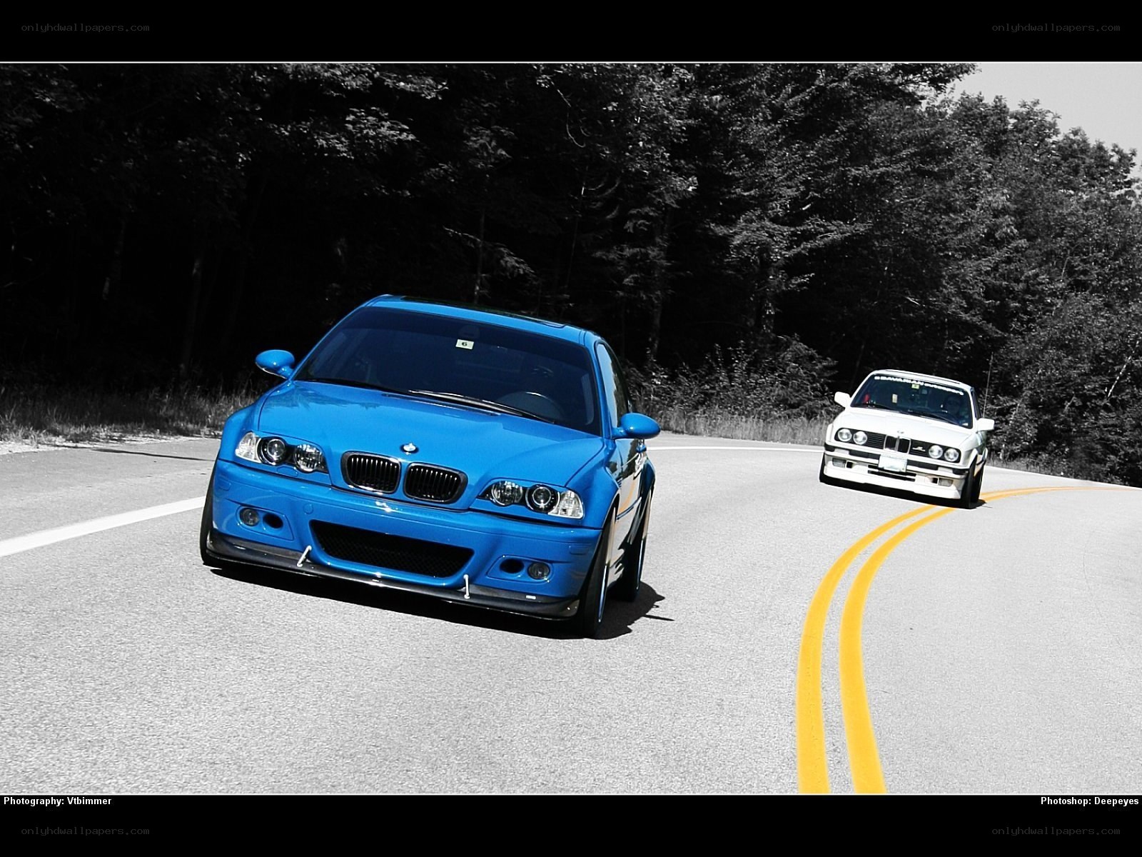Blue and white BMWs on a road
