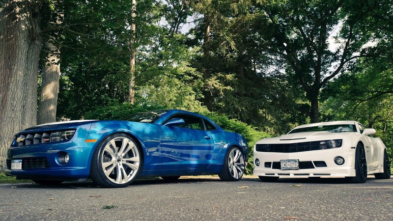 Blue and white Camaro cars