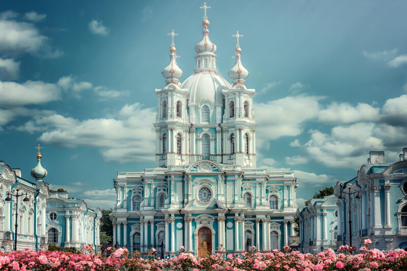 Blue and white cathedral with pink flowers