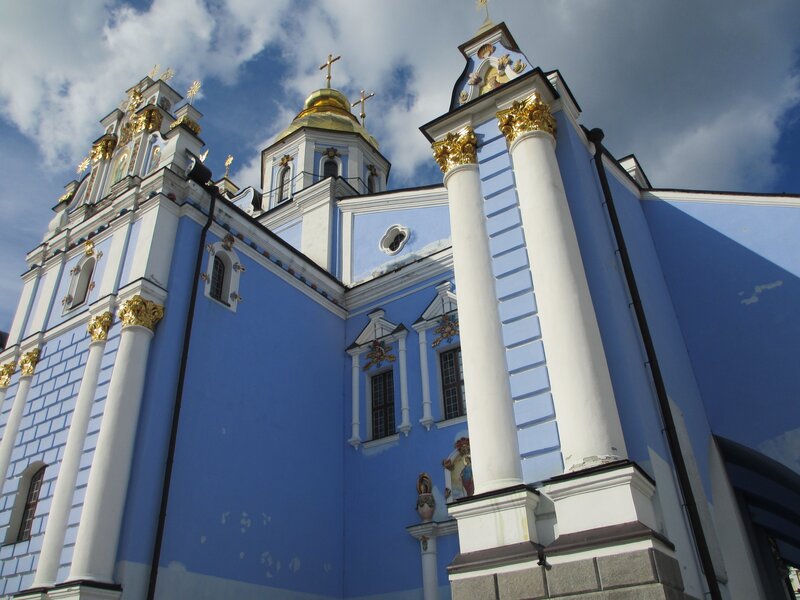 Blue and white church with golden domes