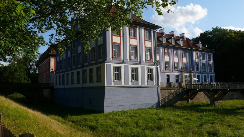 blue and white palace with bridge