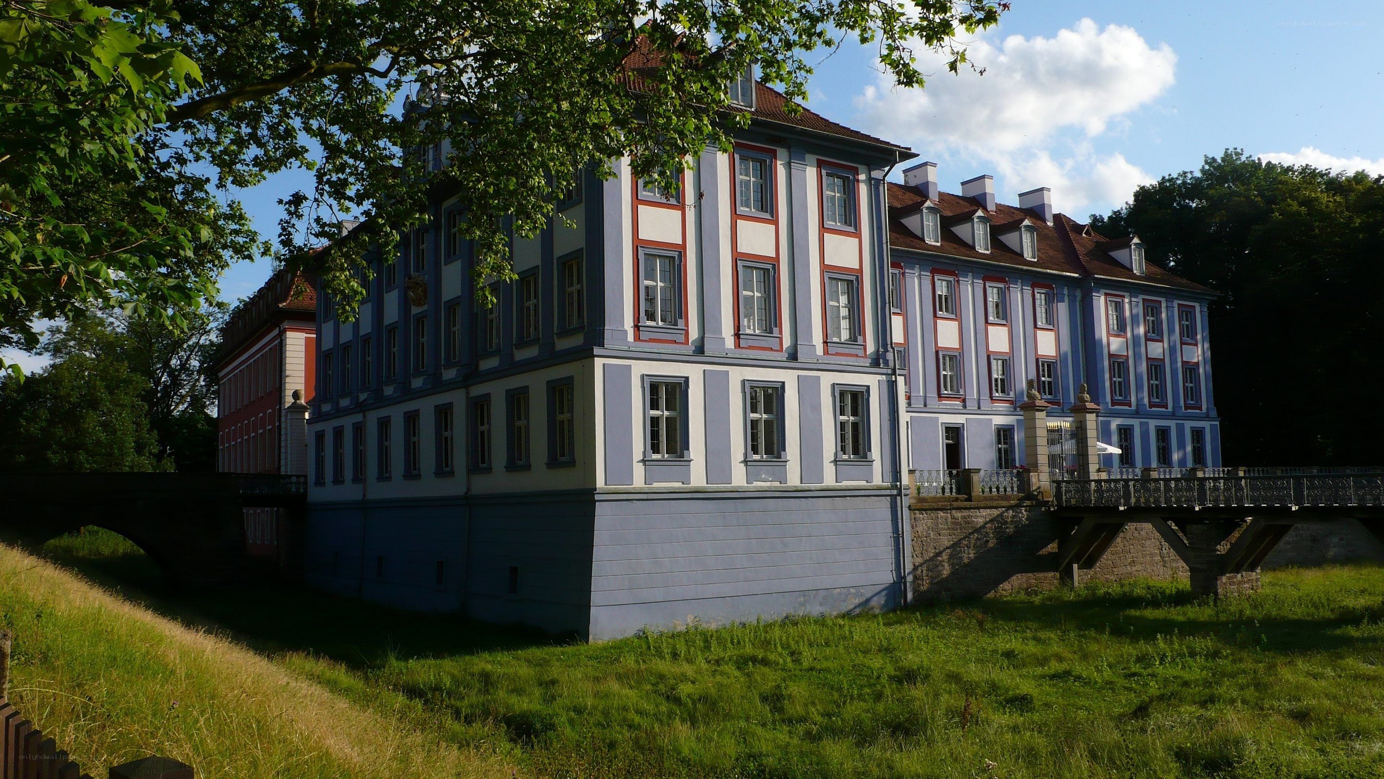 blue and white palace with bridge