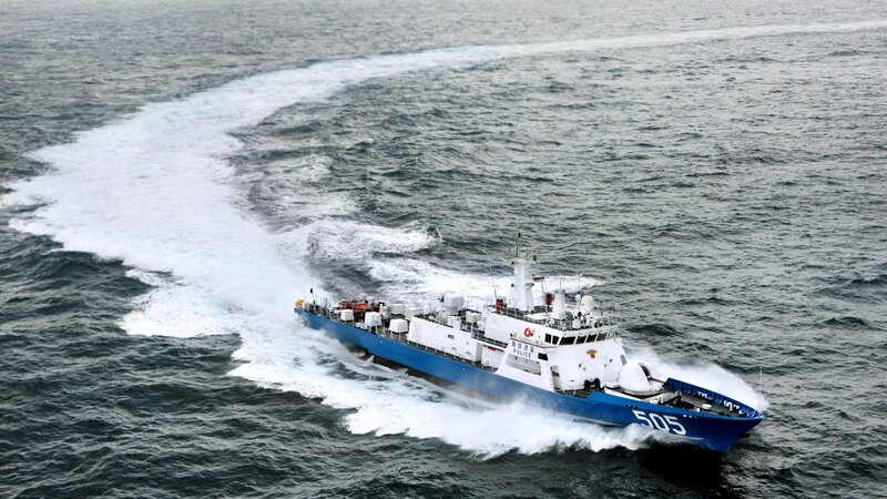 blue and white patrol boat at sea