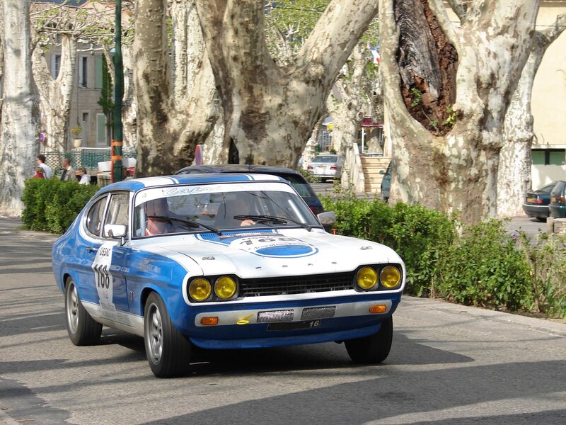 Blue and white race car on street