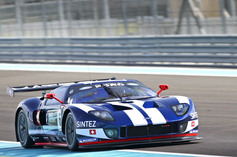 blue and white race car on track