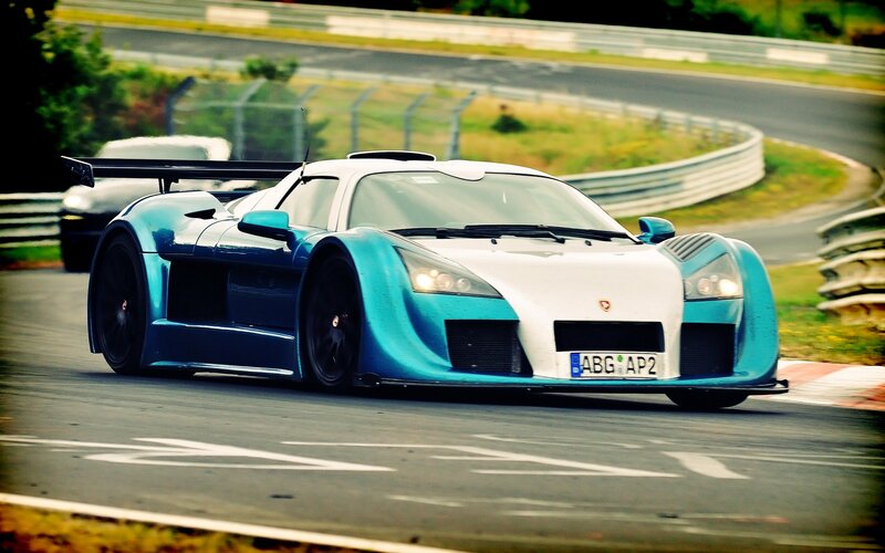 blue and white race car on track