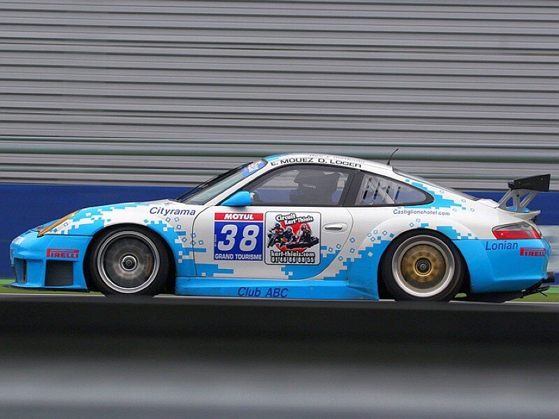 Blue and white race car on track