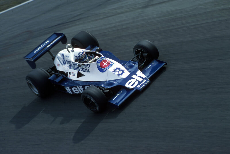 Blue and white race car on track