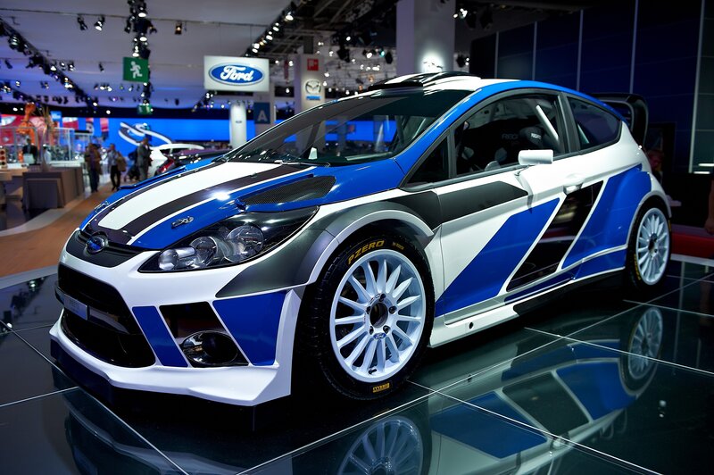 Blue and white rally car on display