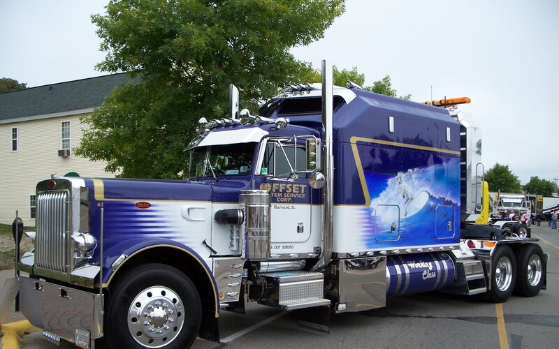 Blue and white semi-truck with custom paint