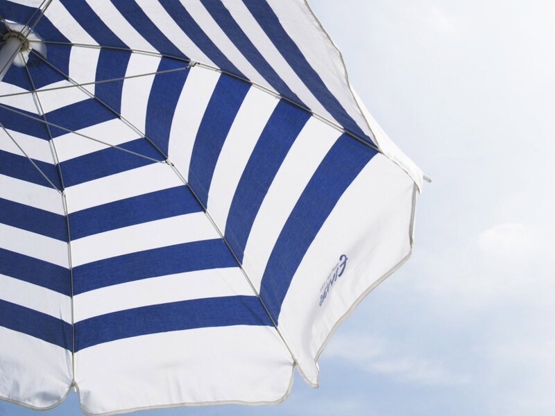blue and white striped beach umbrella