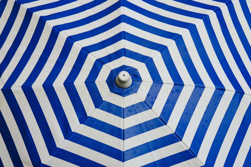 blue and white striped umbrella