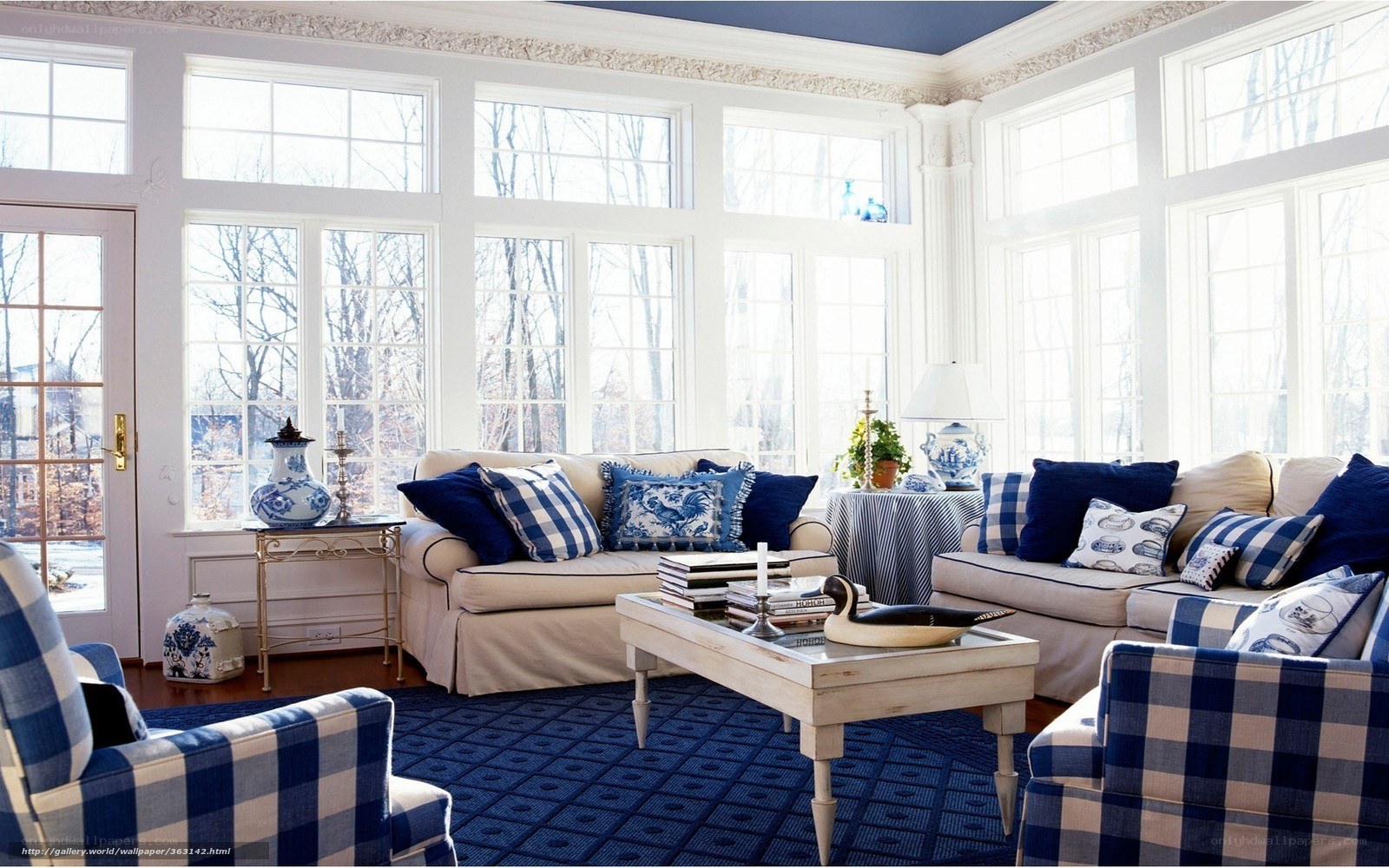 Blue and white sunroom living space