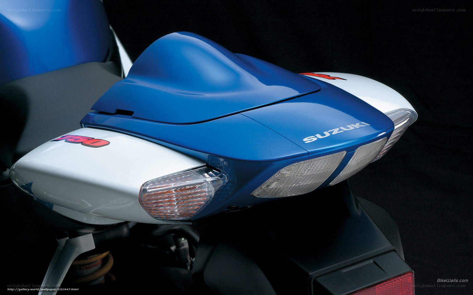 blue and white suzuki motorcycle
