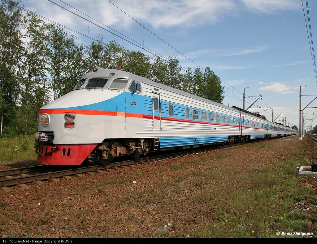 Blue and white train on tracks