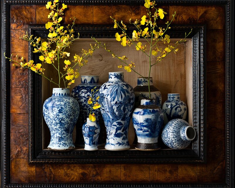 Blue and white vases with yellow flowers