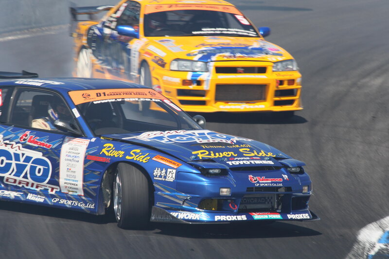 Blue and yellow drift cars racing