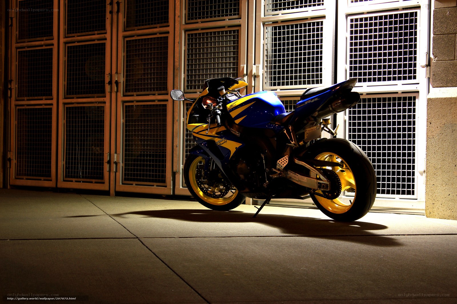 blue and yellow motorcycle at night