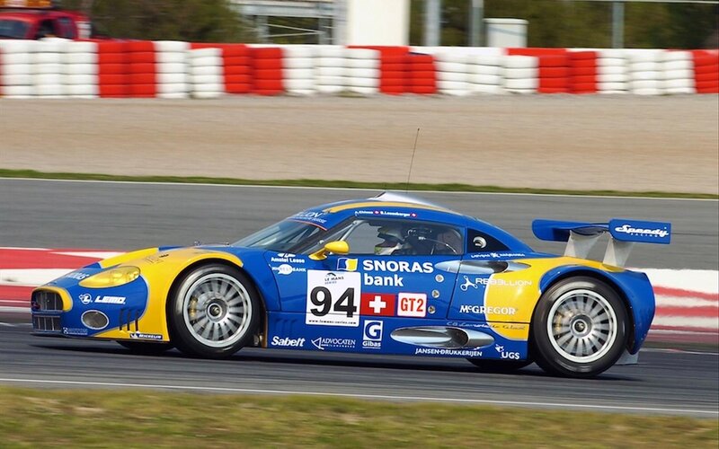 Blue and Yellow Race Car — Dynamic, Afternoon, Photograph, Race Track