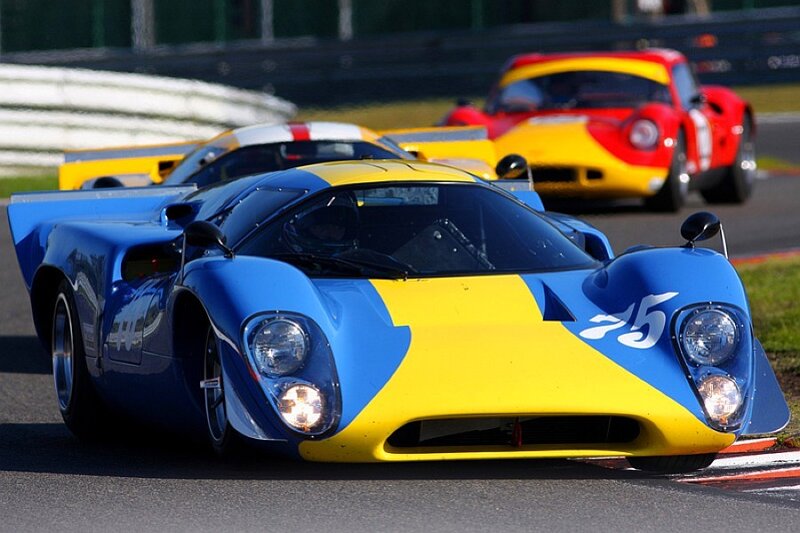 Blue and yellow race car on track